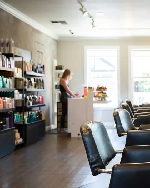 Bright salon floor with styling chairs and mirrors